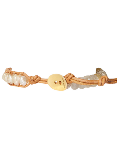 Luna single wrap bracelet This bold single wrap bracelet features faceted rutilated quartz beads, pearls woven between natural leather, and a half moon labradorite pendant secured with a distinctive hook. By Chan Luu.