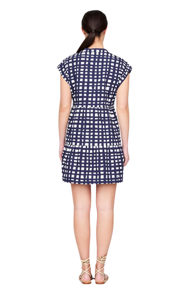 Marie Oliver blue and white navy and ivory printed Owen dress. A playful babydoll take on a classic button-front shirt dress, Owen bridges the gap between work and play. Though the tailored silhouette is perfectly appropriate for a weekday lunch meeting, it’s equally suited to a July Fourth barbecue.